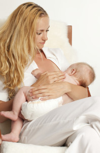 woman breast feeding with implants