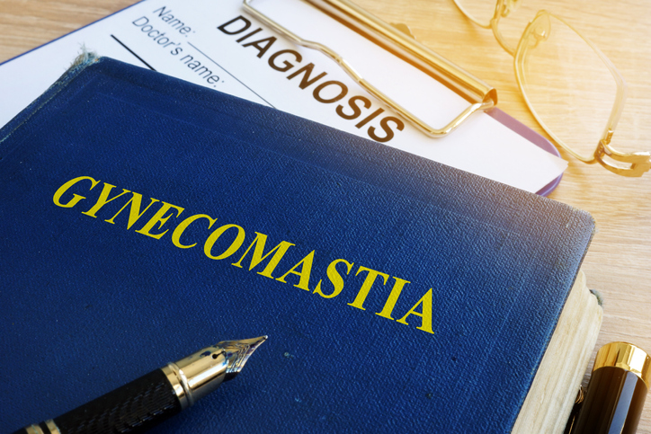 Book about Gynecomastia on a hospital table.