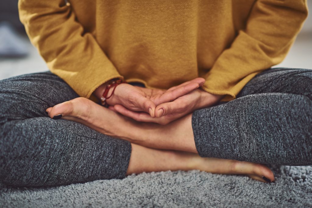 woman in cross legged position